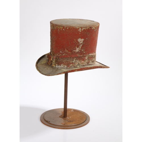 56 - AN AMUSING FRENCH EARLY 20TH CENTURY TOLE TOP HAT TRADE SIGN. in red, raised on an associated stand,... 