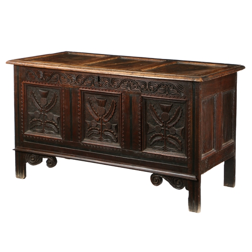 580 - A CHARLES II OAK COFFER, CIRCA 1660. Having a triple-panelled lid, the front with three panels, each... 