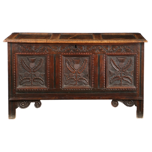 580 - A CHARLES II OAK COFFER, CIRCA 1660. Having a triple-panelled lid, the front with three panels, each... 