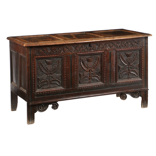 580 - A CHARLES II OAK COFFER, CIRCA 1660. Having a triple-panelled lid, the front with three panels, each... 