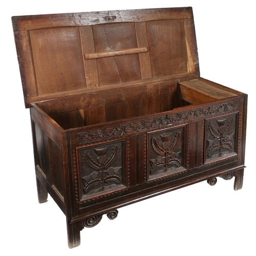 580 - A CHARLES II OAK COFFER, CIRCA 1660. Having a triple-panelled lid, the front with three panels, each... 