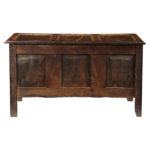 580 - A CHARLES II OAK COFFER, CIRCA 1660. Having a triple-panelled lid, the front with three panels, each... 