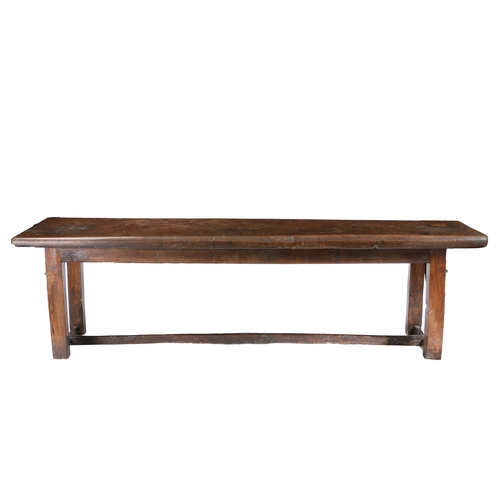 581 - A 16TH/17TH CENTURY OAK AND WALNUT REFECTORY TABLE. Having an impressive single-piece and deep recta... 