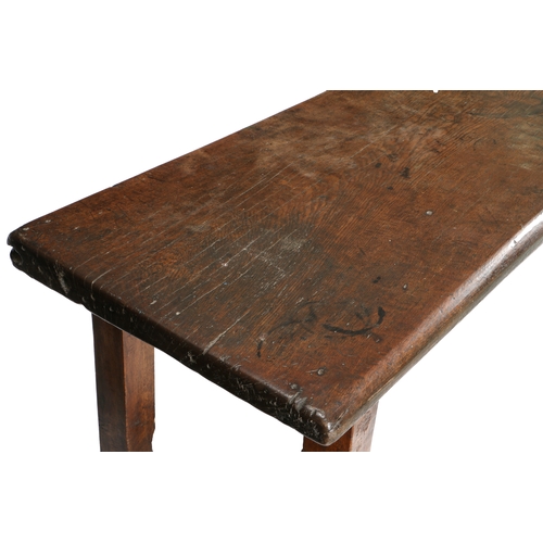 581 - A 16TH/17TH CENTURY OAK AND WALNUT REFECTORY TABLE. Having an impressive single-piece and deep recta... 