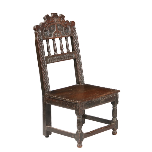 585 - A CHARLES II OAK BACKSTOOL, SOUTH YORKSHIRE, PROBABLY SHEFFIELD, CIRCA 1660. Having an arched cresti... 