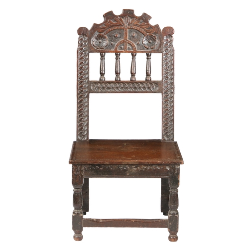 585 - A CHARLES II OAK BACKSTOOL, SOUTH YORKSHIRE, PROBABLY SHEFFIELD, CIRCA 1660. Having an arched cresti... 