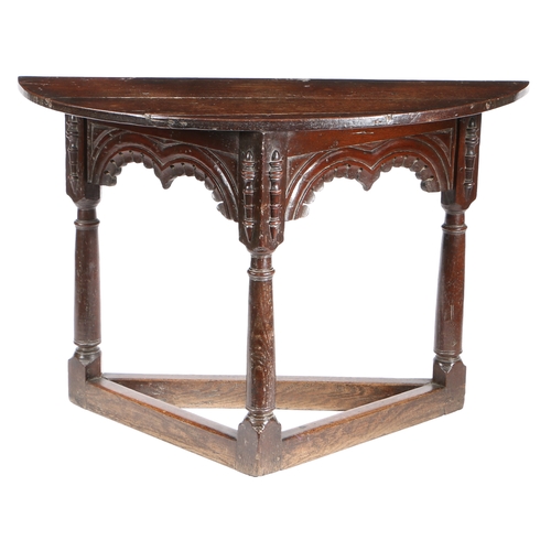 586 - A CHARLES I OAK CREDENCE-TYPE TABLE, DERBYSHIRE/YORKSHIRE, CIRCA 1630. Having a semi-circular top, a... 