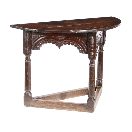 586 - A CHARLES I OAK CREDENCE-TYPE TABLE, DERBYSHIRE/YORKSHIRE, CIRCA 1630. Having a semi-circular top, a... 