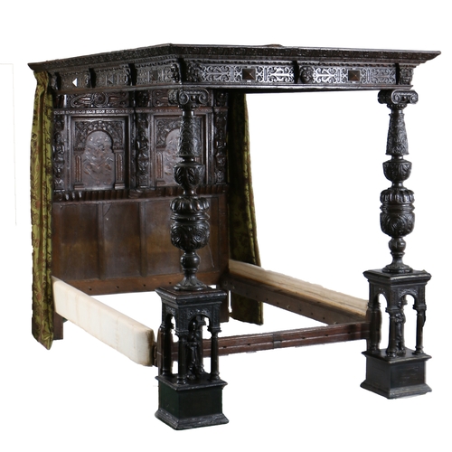 590 - AN IMPRESSIVE ELIZABETH I OAK AND INLAID TESTER BED, CIRCA 1580 AND LATER. The panelled tester centr... 