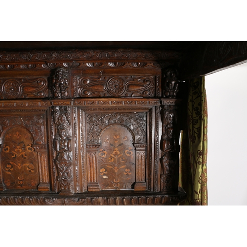 590 - AN IMPRESSIVE ELIZABETH I OAK AND INLAID TESTER BED, CIRCA 1580 AND LATER. The panelled tester centr... 