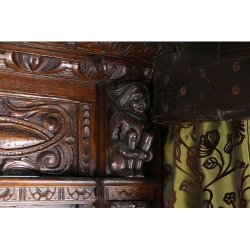 590 - AN IMPRESSIVE ELIZABETH I OAK AND INLAID TESTER BED, CIRCA 1580 AND LATER. The panelled tester centr... 