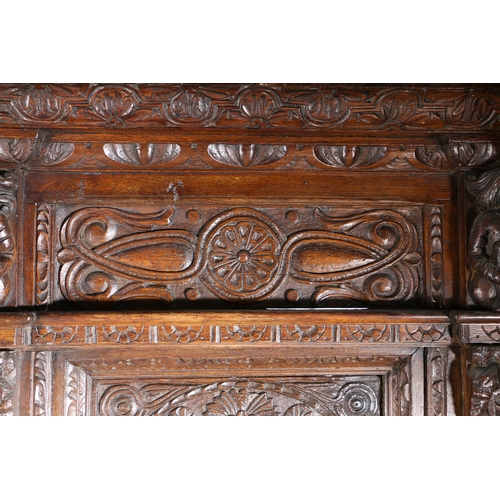 590 - AN IMPRESSIVE ELIZABETH I OAK AND INLAID TESTER BED, CIRCA 1580 AND LATER. The panelled tester centr... 