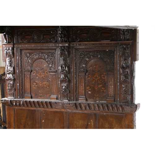 590 - AN IMPRESSIVE ELIZABETH I OAK AND INLAID TESTER BED, CIRCA 1580 AND LATER. The panelled tester centr... 