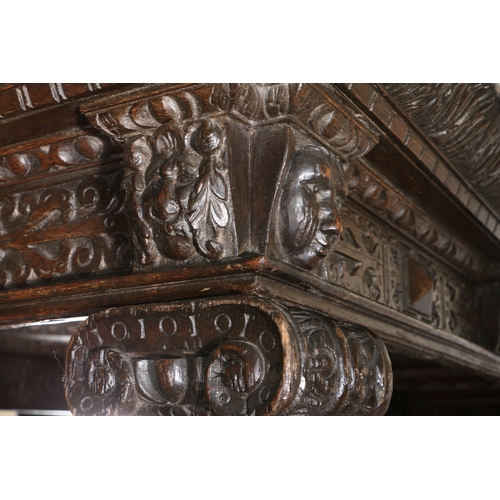 590 - AN IMPRESSIVE ELIZABETH I OAK AND INLAID TESTER BED, CIRCA 1580 AND LATER. The panelled tester centr... 