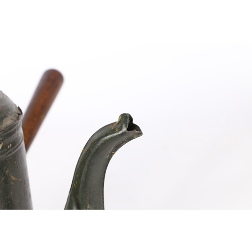 68 - A 19TH CENTURY TOLEWARE COFFEE POT. The petal final above a domed lid and tapered body with a fluted... 