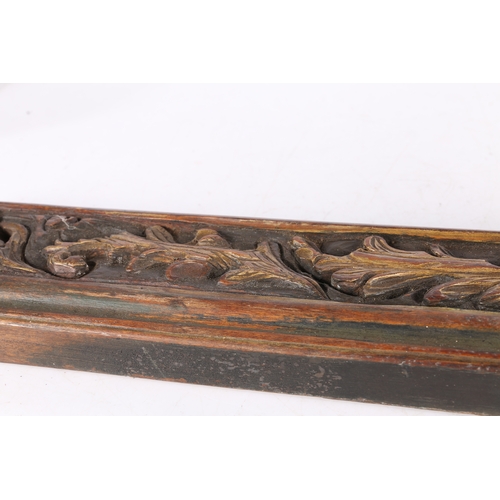 69 - A 19TH CENTURY SCANDINAVIAN TREEN MANGLE BOARD. carved with scrolling leaves and with a stylized hor... 