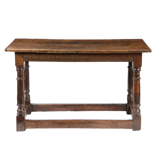 7 - A 17TH CENTURY OAK TABLE. the rectangular top above turned knopped legs united by plain stretchers, ... 