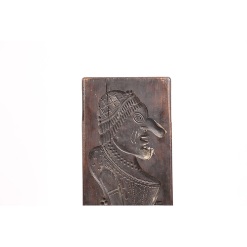 71 - A LARGE GERMAN CARVED FRUITWOOD GINGERBREAD MOULD 19TH CENTURY. Carved in low relief depicting a man... 