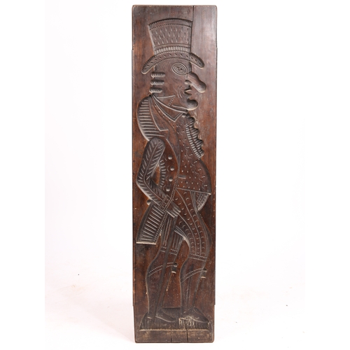 71 - A LARGE GERMAN CARVED FRUITWOOD GINGERBREAD MOULD 19TH CENTURY. Carved in low relief depicting a man... 