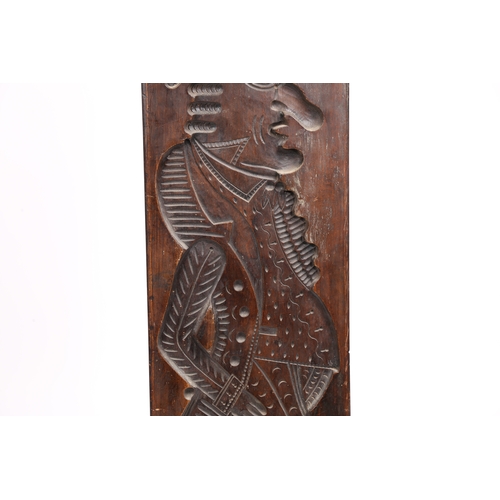 71 - A LARGE GERMAN CARVED FRUITWOOD GINGERBREAD MOULD 19TH CENTURY. Carved in low relief depicting a man... 