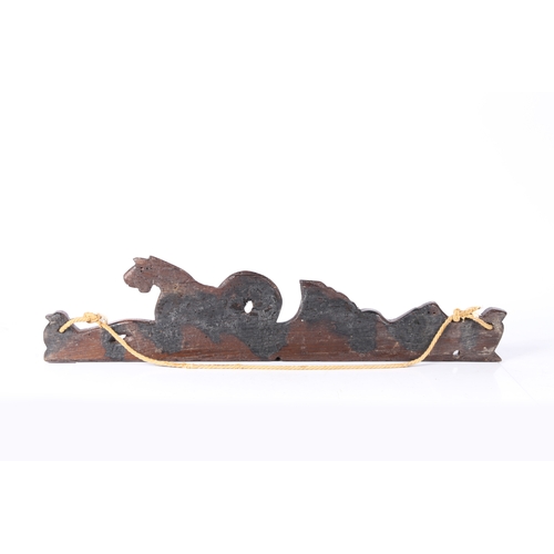 79 - A 17TH CENTURY CARVED OAK RAIL, CIRCA 1660. Designed as a hippocamp, of elongated form, with a bird ... 