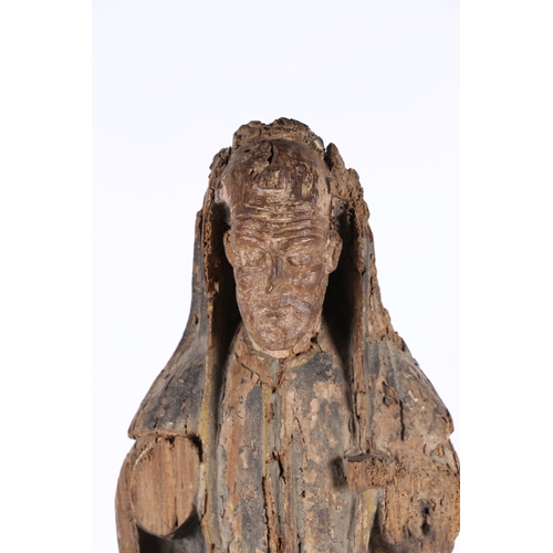 85 - A RARE ENGLISH EARLY 15TH CENTURY CARVED WOOD SAINT. circa 1400, depicting a hooded saint set on a l... 