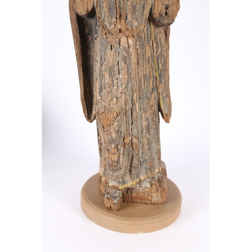 85 - A RARE ENGLISH EARLY 15TH CENTURY CARVED WOOD SAINT. circa 1400, depicting a hooded saint set on a l... 