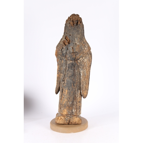 85 - A RARE ENGLISH EARLY 15TH CENTURY CARVED WOOD SAINT. circa 1400, depicting a hooded saint set on a l... 