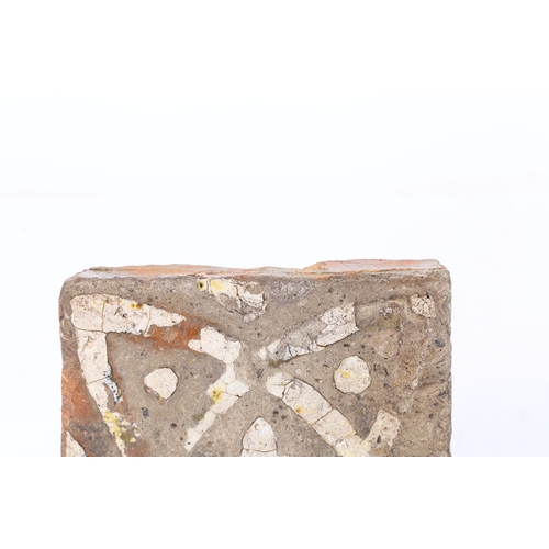 89 - A 15TH CENTURY EARTHENWARE FLOOR TILE, ENGLISH. Decorated with a creamy-while slip quatrefoil design... 