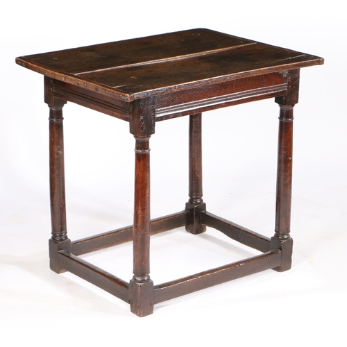 9 - A CHARLES I OAK CENTRE TABLE, CIRCA 1640. Having a twin-boarded cleated top, with narrow run-moulded... 