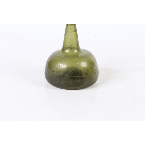 94 - A 18TH CENTURY ENGLISH ONION WINE BOTTLE. having a dumpy stem and bulbous body, 16.5cm high.