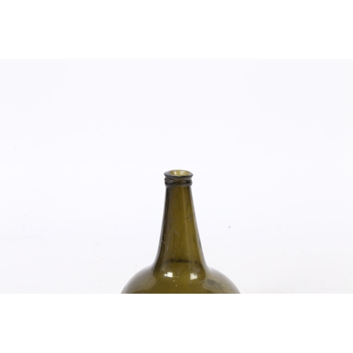 95 - A 18TH CENTURY ENGLISH ONION WINE BOTTLE. having a dumpy stem above a bulbous body, 18.5cm high.