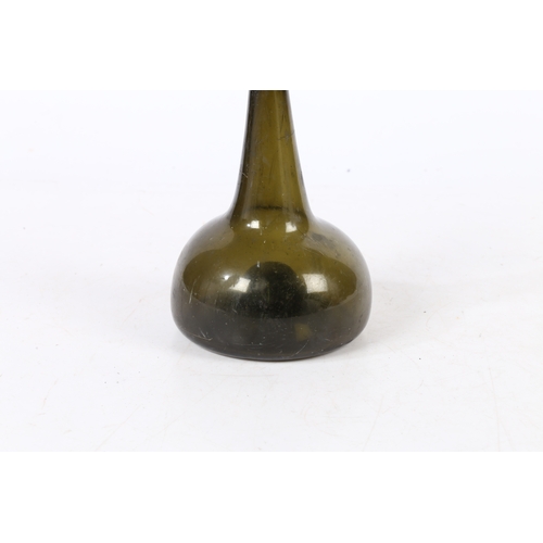 95 - A 18TH CENTURY ENGLISH ONION WINE BOTTLE. having a dumpy stem above a bulbous body, 18.5cm high.