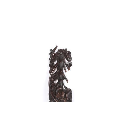 97 - A CARVED WALNUT APPLIQUÉ, ENGLISH, CIRCA 1700-30. In the manner of Grinling Gibbons, carved and pier... 