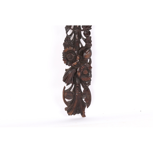 97 - A CARVED WALNUT APPLIQUÉ, ENGLISH, CIRCA 1700-30. In the manner of Grinling Gibbons, carved and pier... 