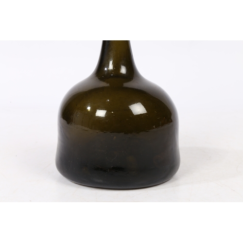 99 - A MID 18TH CENTURY GREEN MALLET BOTTLE. having a slender neck above a bulbous mallet body, 19cm high... 