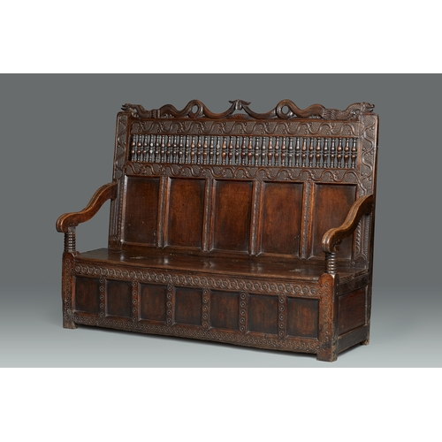 105 - AN EXCEPTIONAL LARGE ELIZABETHAN OAK SETTLE, WITH REMARAKBLE DOUBLE SERPENT CRESTING IN WALNUT, ENGL... 