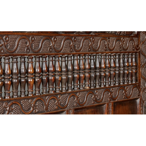 105 - AN EXCEPTIONAL LARGE ELIZABETHAN OAK SETTLE, WITH REMARAKBLE DOUBLE SERPENT CRESTING IN WALNUT, ENGL... 