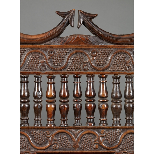 105 - AN EXCEPTIONAL LARGE ELIZABETHAN OAK SETTLE, WITH REMARAKBLE DOUBLE SERPENT CRESTING IN WALNUT, ENGL... 