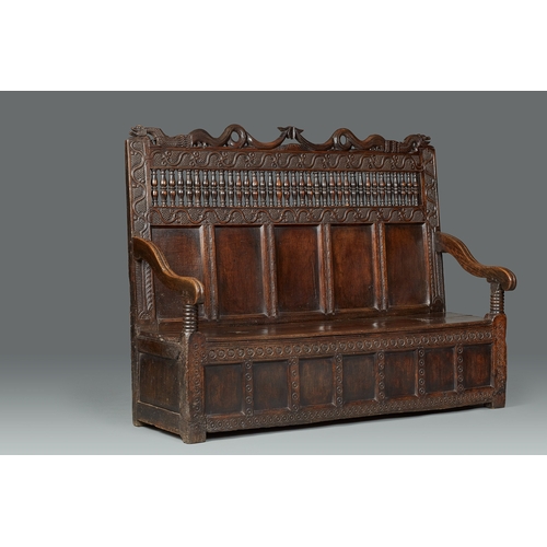 105 - AN EXCEPTIONAL LARGE ELIZABETHAN OAK SETTLE, WITH REMARAKBLE DOUBLE SERPENT CRESTING IN WALNUT, ENGL... 