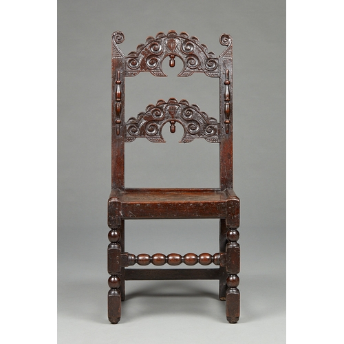 107 - A FINE QUALITY OAK SINGLE CHAIR WITH TWIN MASKS, YORKSHIRE, CIRCA 1650-1660. The splayed uprights te... 