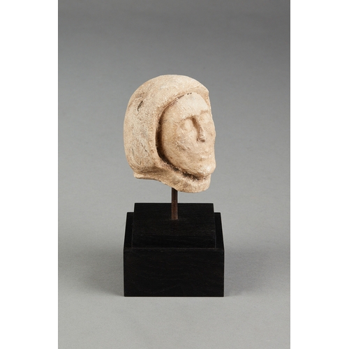 108 - A SMALL 15TH CENTURY PORTLAND STONE HEAD OF A MONK, ENGLISH, DORSET, CIRCA 14001450. The small size... 