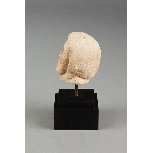 108 - A SMALL 15TH CENTURY PORTLAND STONE HEAD OF A MONK, ENGLISH, DORSET, CIRCA 14001450. The small size... 