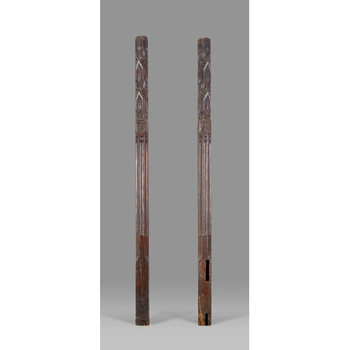 12 - A RARE PAIR OF HENRY VIII TUDOR OAK MONOGRAMMED BEDPOSTS, ENGLISH, CIRCA 1520-1540. The pair of Tudo... 