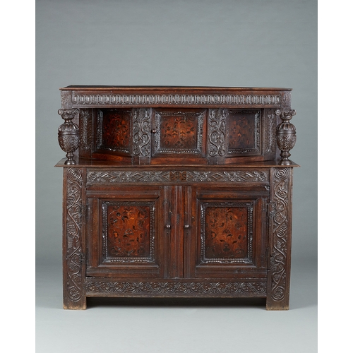 19 - A CHARLES I INLAID OAK CANTED CUPBOARD, YORKSHIRE, LEEDS/HALIFAX, CIRCA 1630. The plank top above ra... 