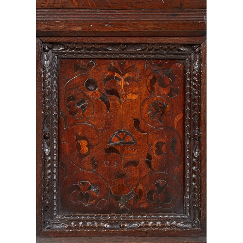 19 - A CHARLES I INLAID OAK CANTED CUPBOARD, YORKSHIRE, LEEDS/HALIFAX, CIRCA 1630. The plank top above ra... 