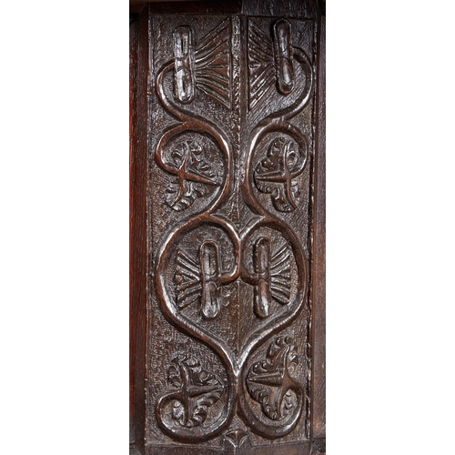 19 - A CHARLES I INLAID OAK CANTED CUPBOARD, YORKSHIRE, LEEDS/HALIFAX, CIRCA 1630. The plank top above ra... 