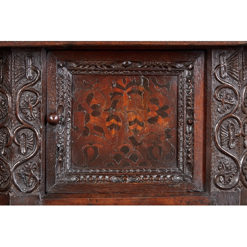 19 - A CHARLES I INLAID OAK CANTED CUPBOARD, YORKSHIRE, LEEDS/HALIFAX, CIRCA 1630. The plank top above ra... 