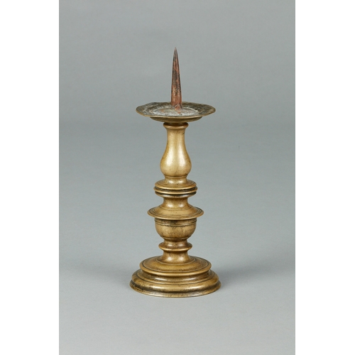 24 - A FINE AND BOLD PAIR OF LARGE 16TH CENTURY BRASS CANDLESTICKS, GERMAN, CIRCA 1580. The large pair of... 