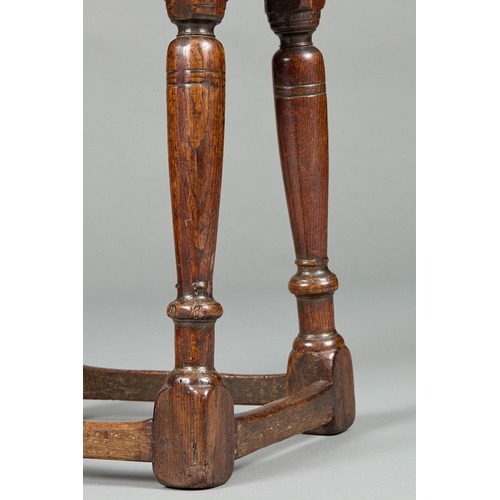 28 - A FINE ELIZABETH I CARVED OAK JOINT STOOL, ENGLISH CIRCA 1590-1600. The moulded plank top above shap... 